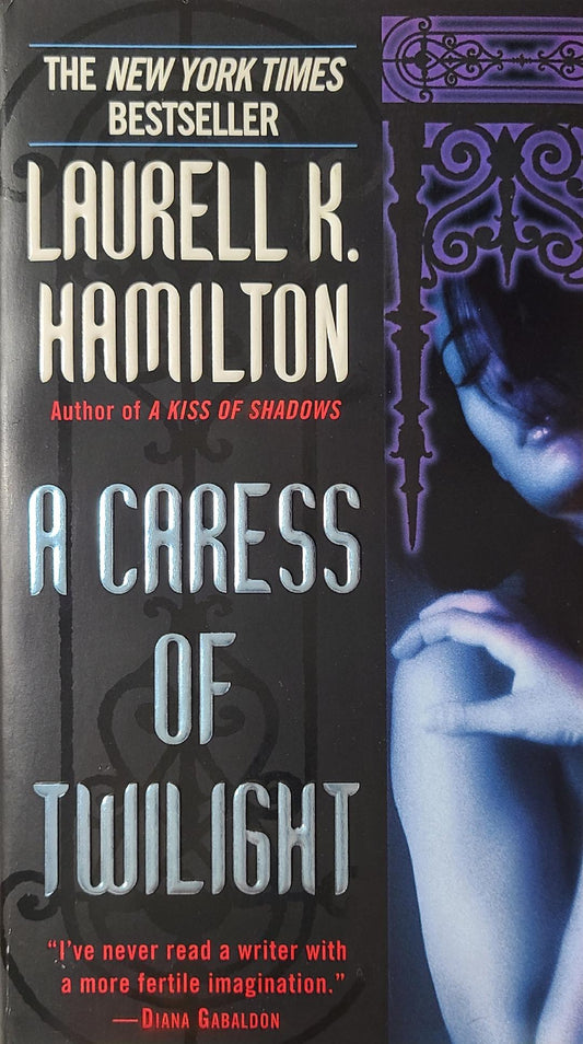 Used A Caress Of Twilight By: Laurell K. Hamilton